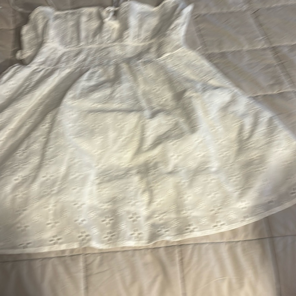 Woman’s white flare dress